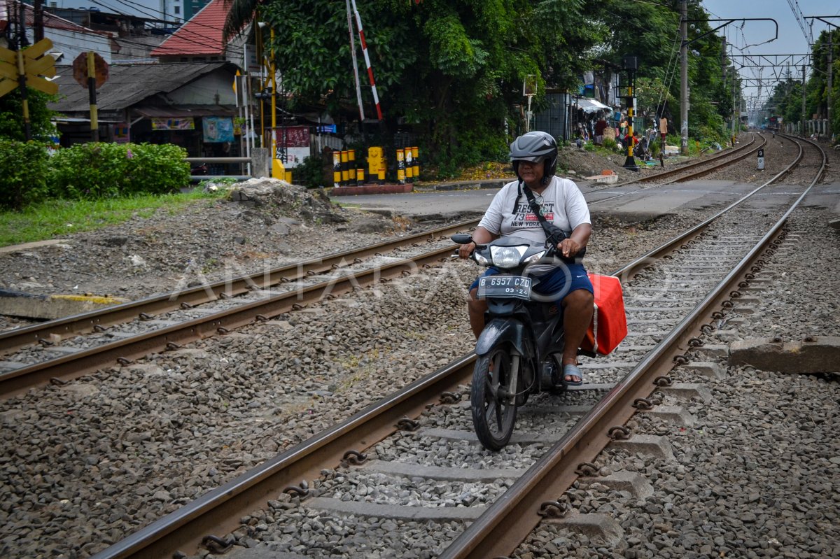 The rider across the train line in Jakarta
