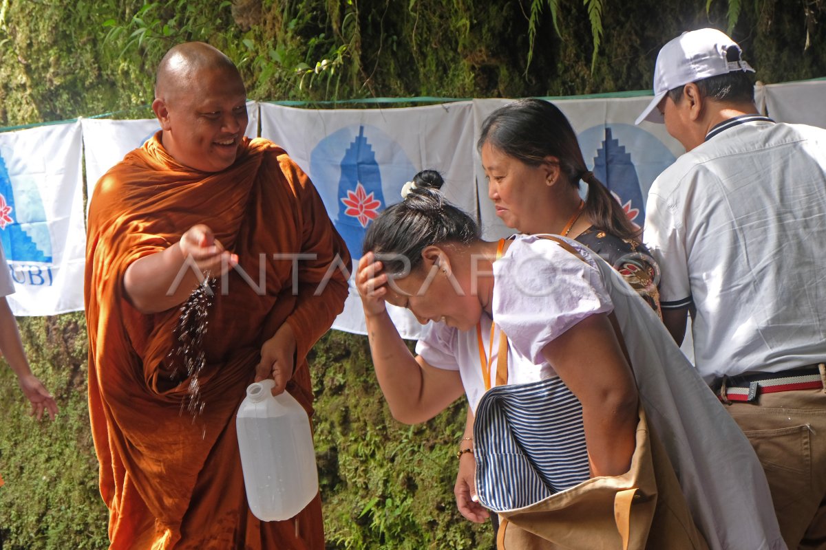 Waisak holy water taking process